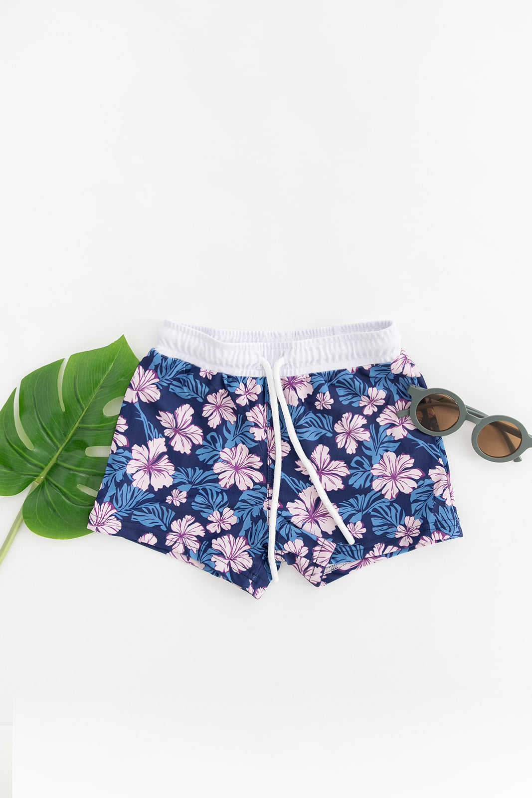 Floral boy's swim shorts with adjustable waistband. Baby, toddler and little boy swim trunks. Matching sibling swim.