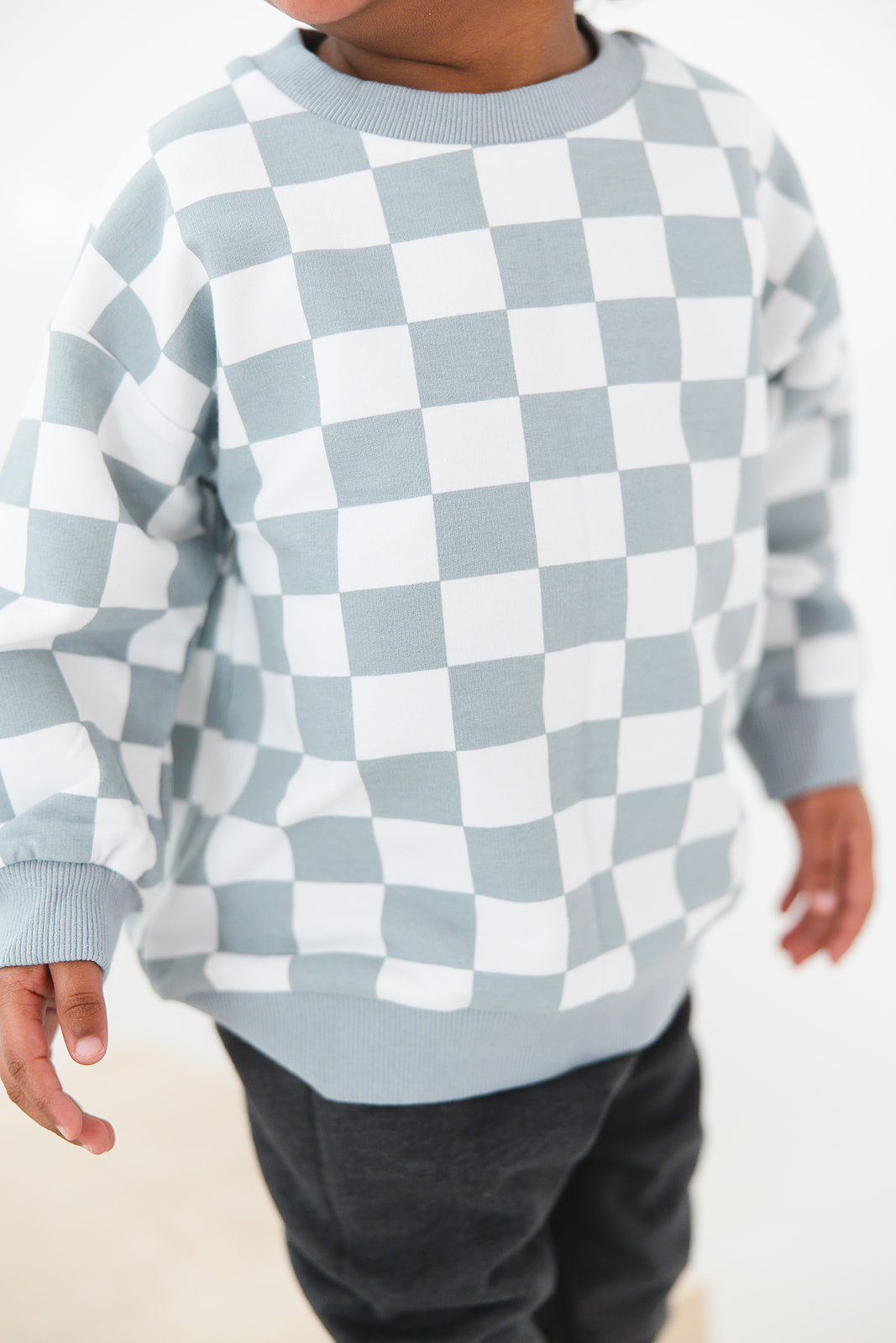 Blue checkered organic cotton sweater for baby and toddler boys and girls.