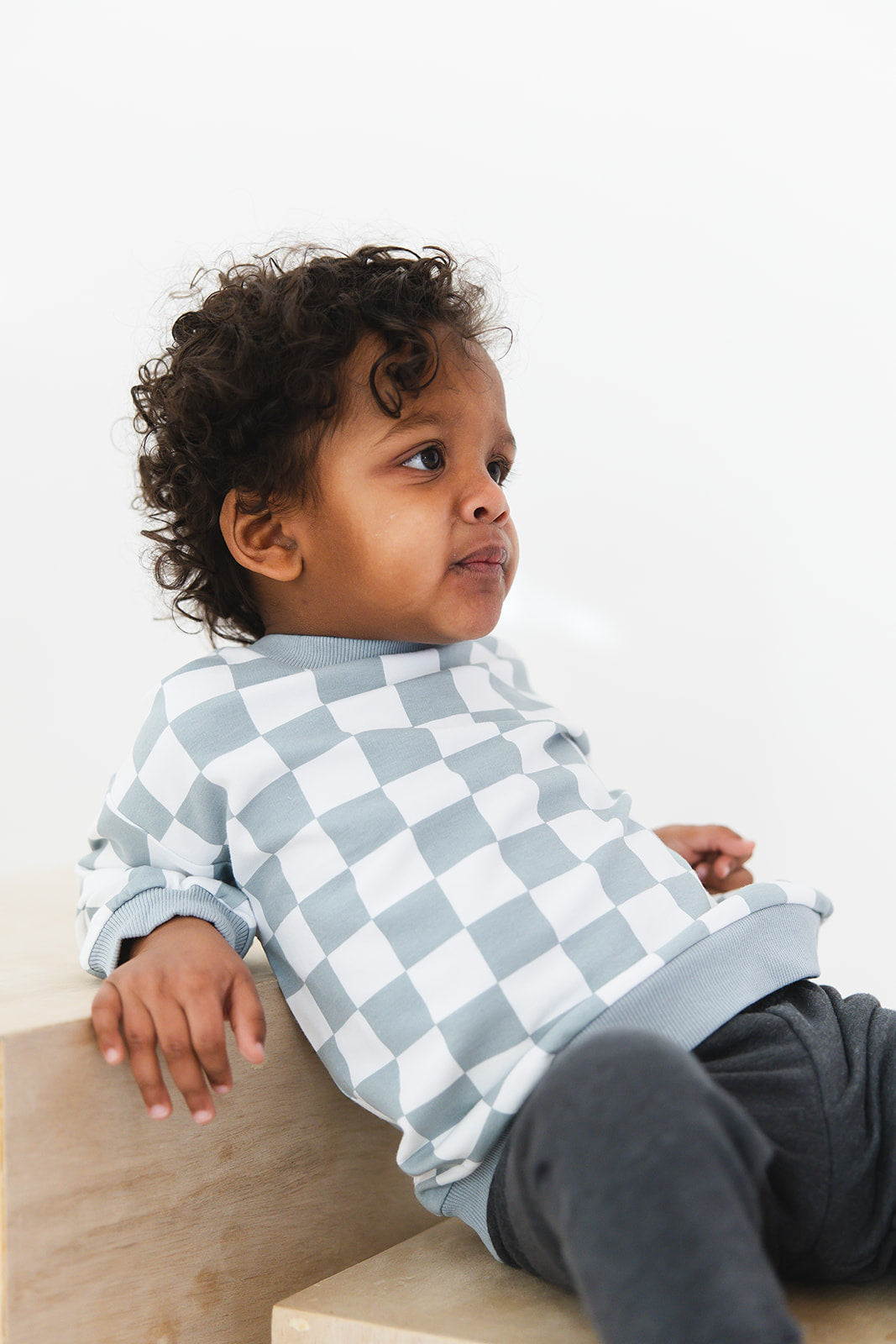 Blue checkered organic cotton sweater for baby and toddler boys and girls.