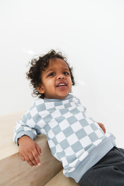 Blue checkered organic cotton sweater for baby and toddler boys and girls.