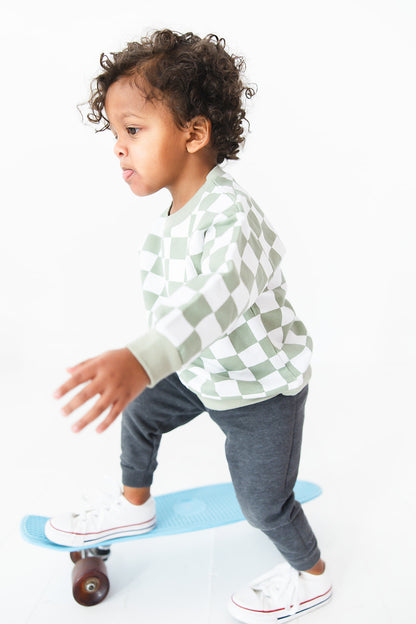 Green checkered organic cotton sweater for baby and toddler boys and girls.