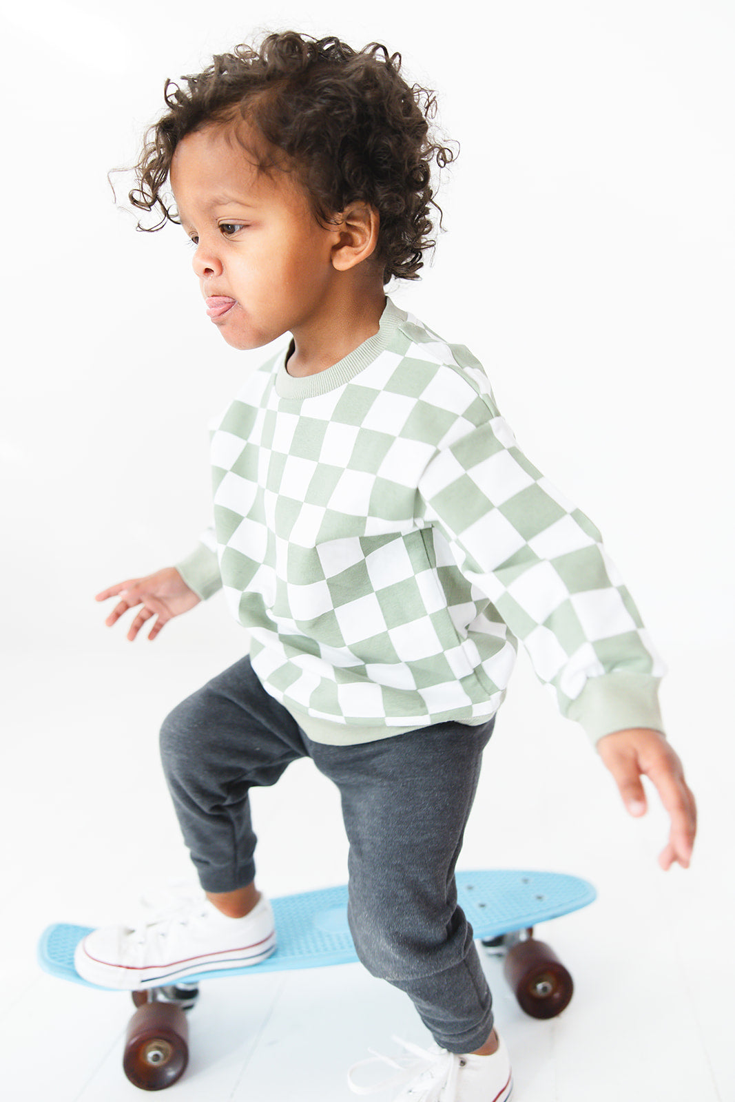 Green checkered organic cotton sweater for baby and toddler boys and girls.