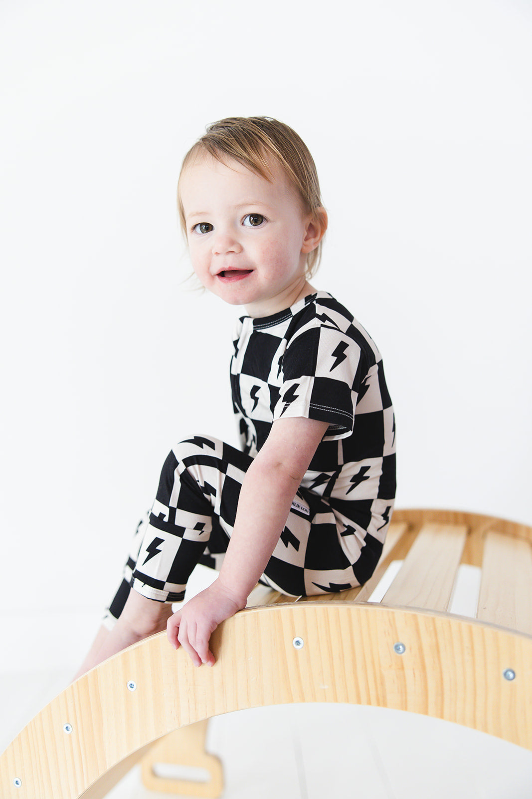 Checkered lightning bamboo short sleeve zipper romper for babies and toddlers, both boys and girls.