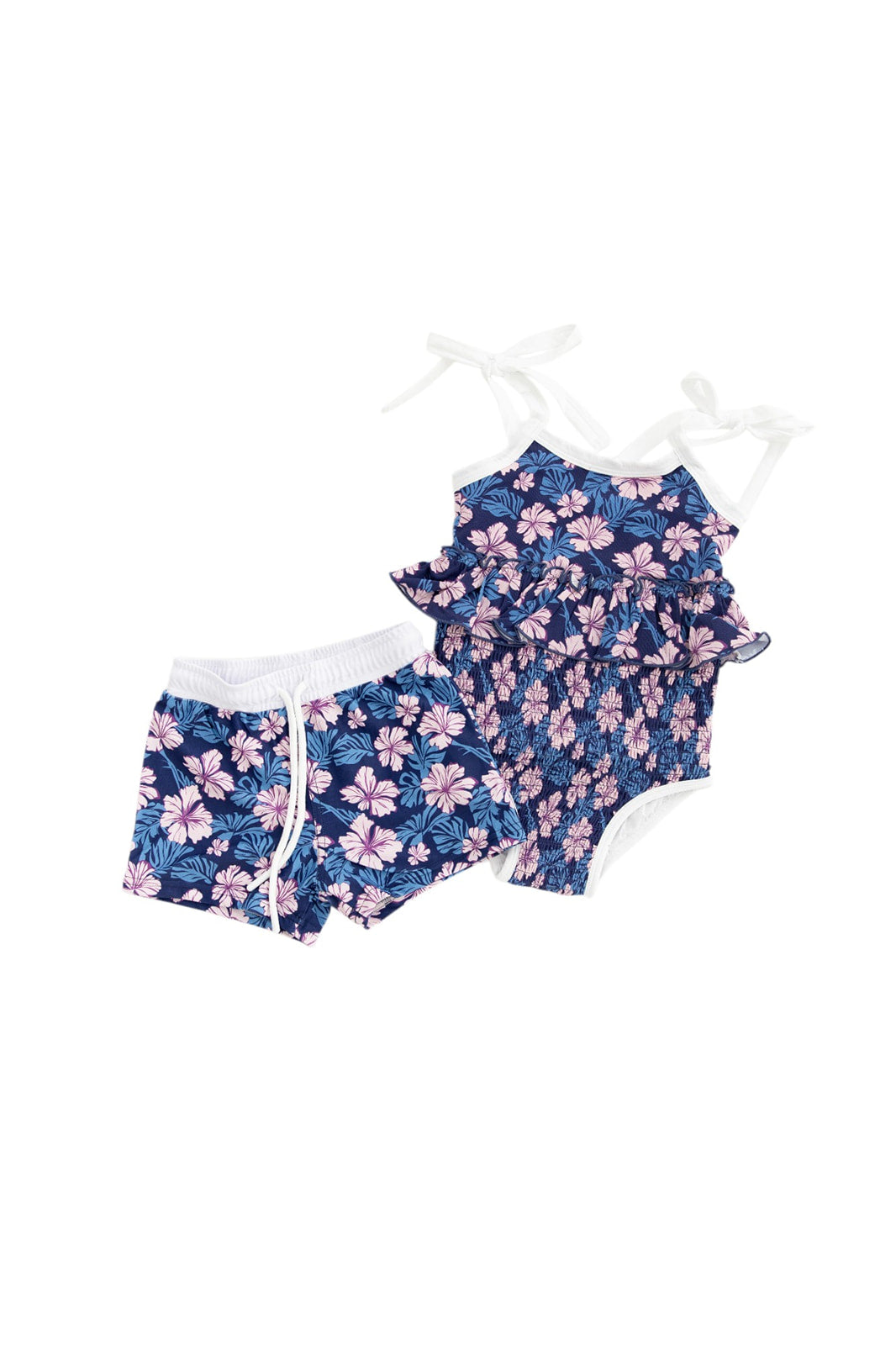 Bathing suit for baby, toddler and little girls. One piece swim suit with pink florals and blue background that is ribbed fabric on the top and smocked on the bottom with adjustable straps that tie into bows.