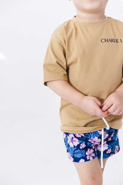 Floral boy's swim shorts with adjustable waistband. Baby, toddler and little boy swim trunks. Matching sibling swim.