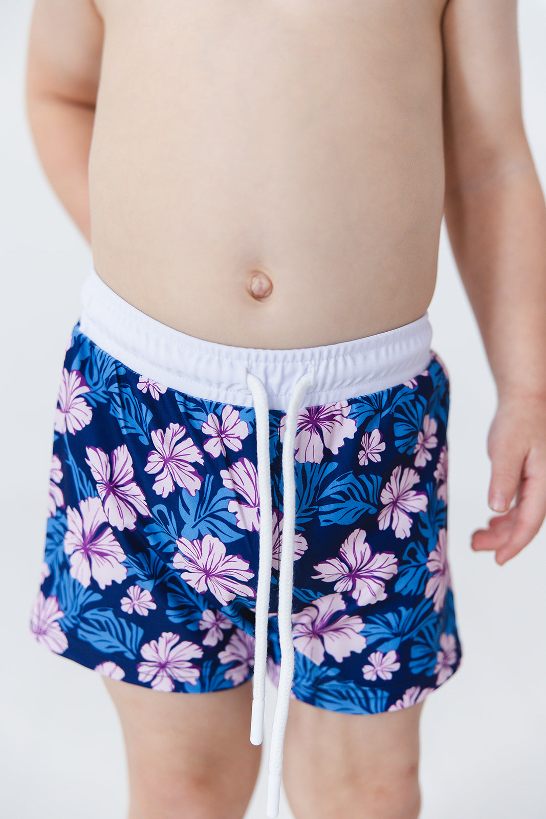 Floral boy's swim shorts with adjustable waistband. Baby, toddler and little boy swim trunks. Matching sibling swim.