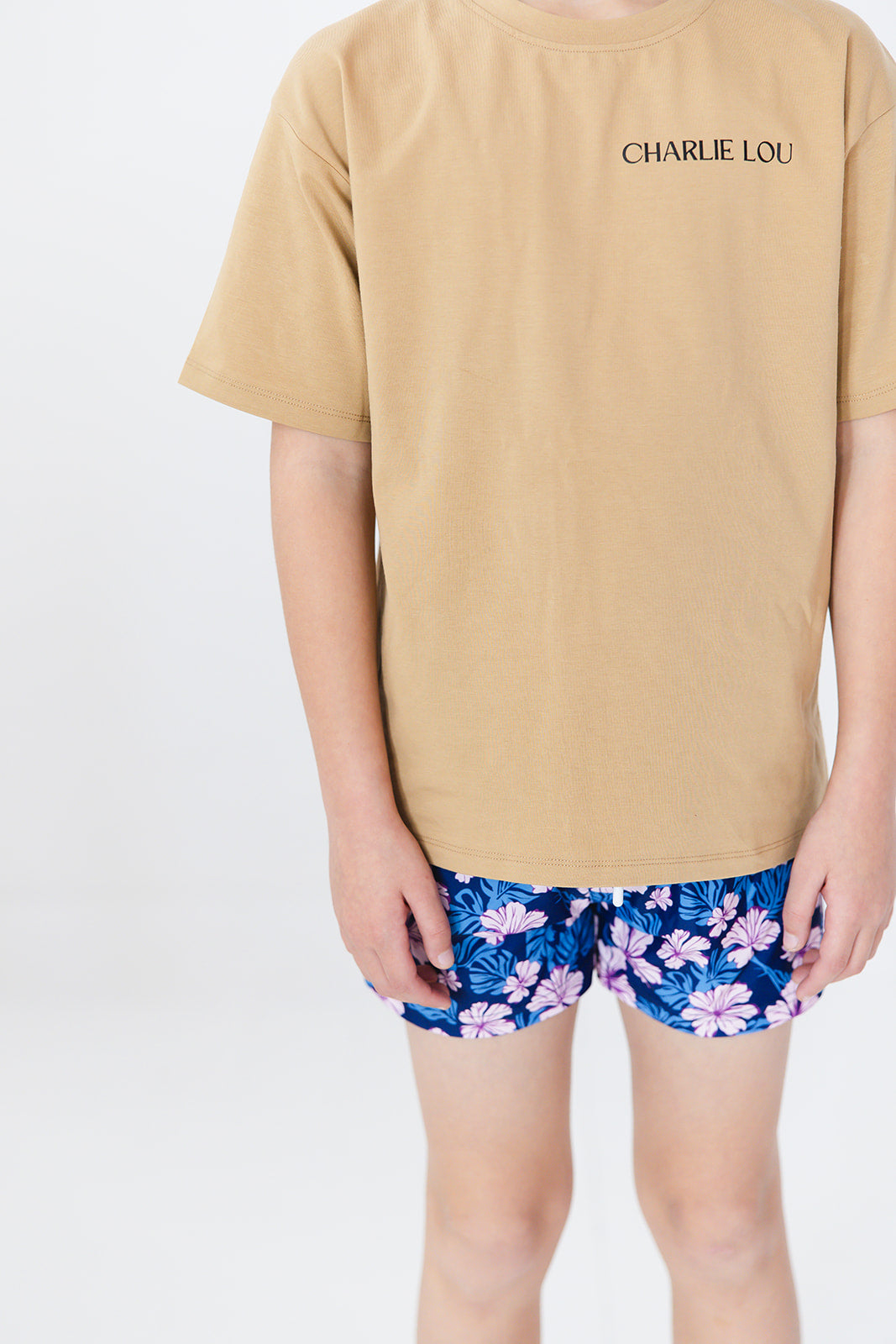 Floral boy's swim shorts with adjustable waistband. Baby, toddler and little boy swim trunks. Matching sibling swim.