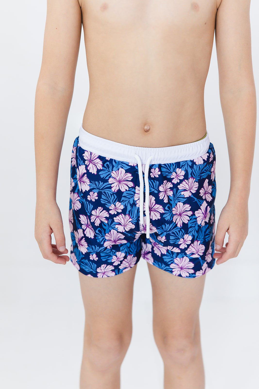 Floral boy's swim shorts with adjustable waistband. Baby, toddler and little boy swim trunks. Matching sibling swim.