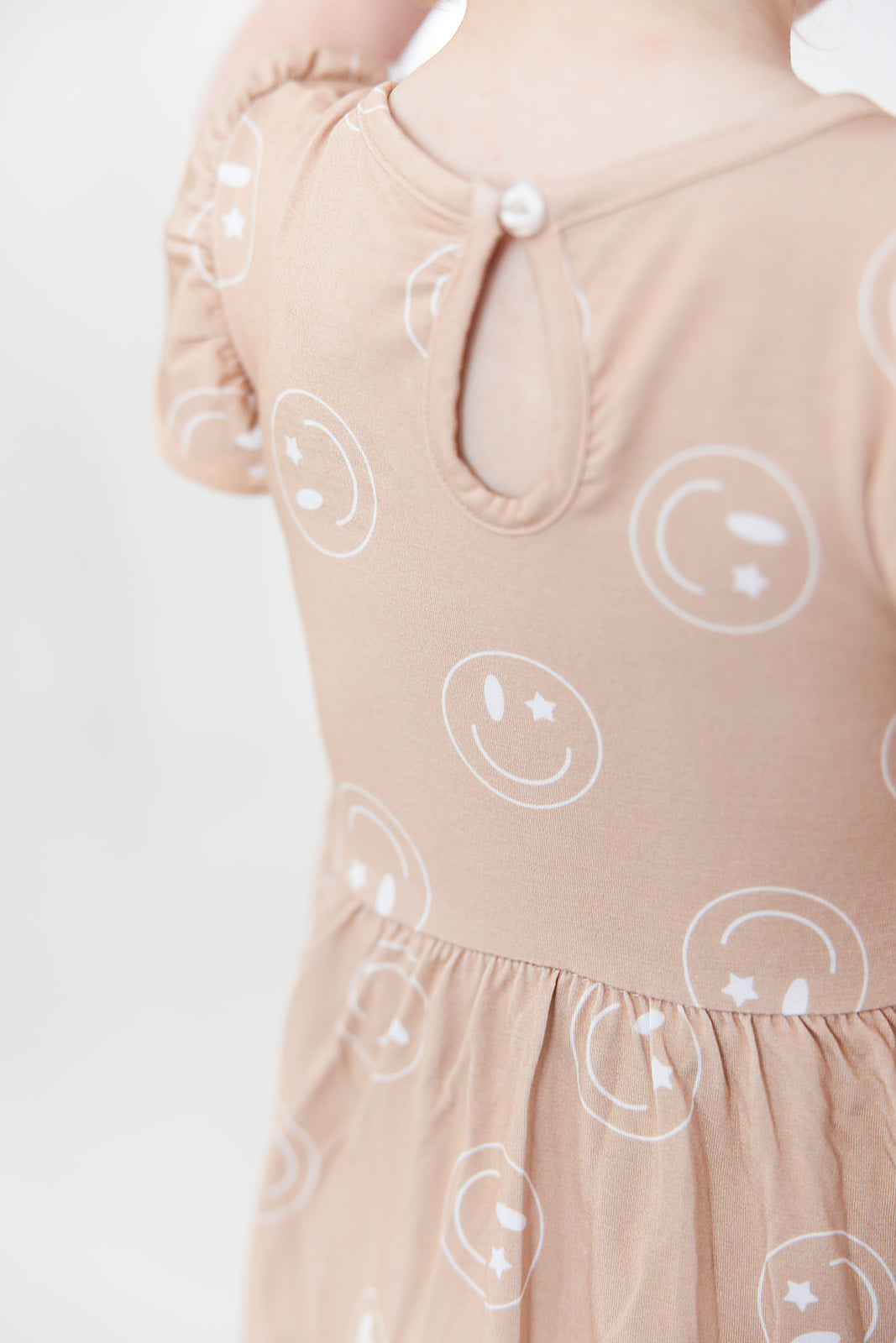 Girl bamboo twirl dress for baby girls or toddler girls in Smiley Face Star print with bodysuit.