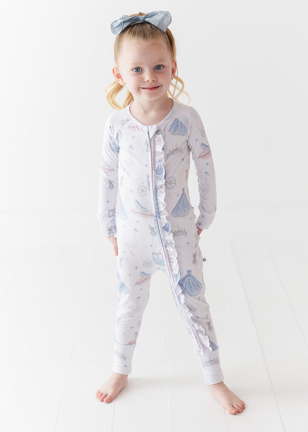 Bamboo convertible double zipper romper with hand and foot cuffs. Zippy has a vintage Disney Cinderella print on it.