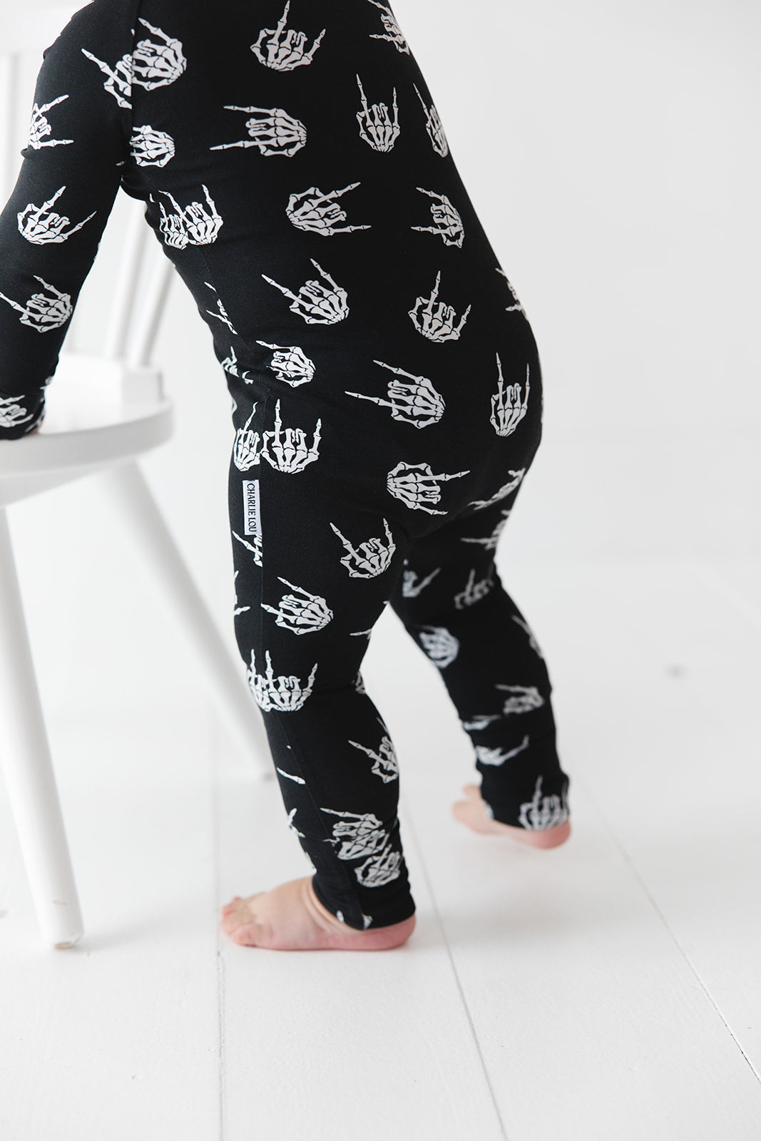 Rock N' Roll Skeleton bamboo zippy convertible romper.