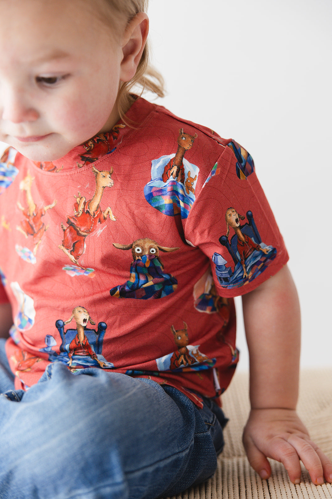 Bamboo T-Shirt for babies and toddlers, both boys and girls. Print features a red background with Llama Llama Red Pajama.