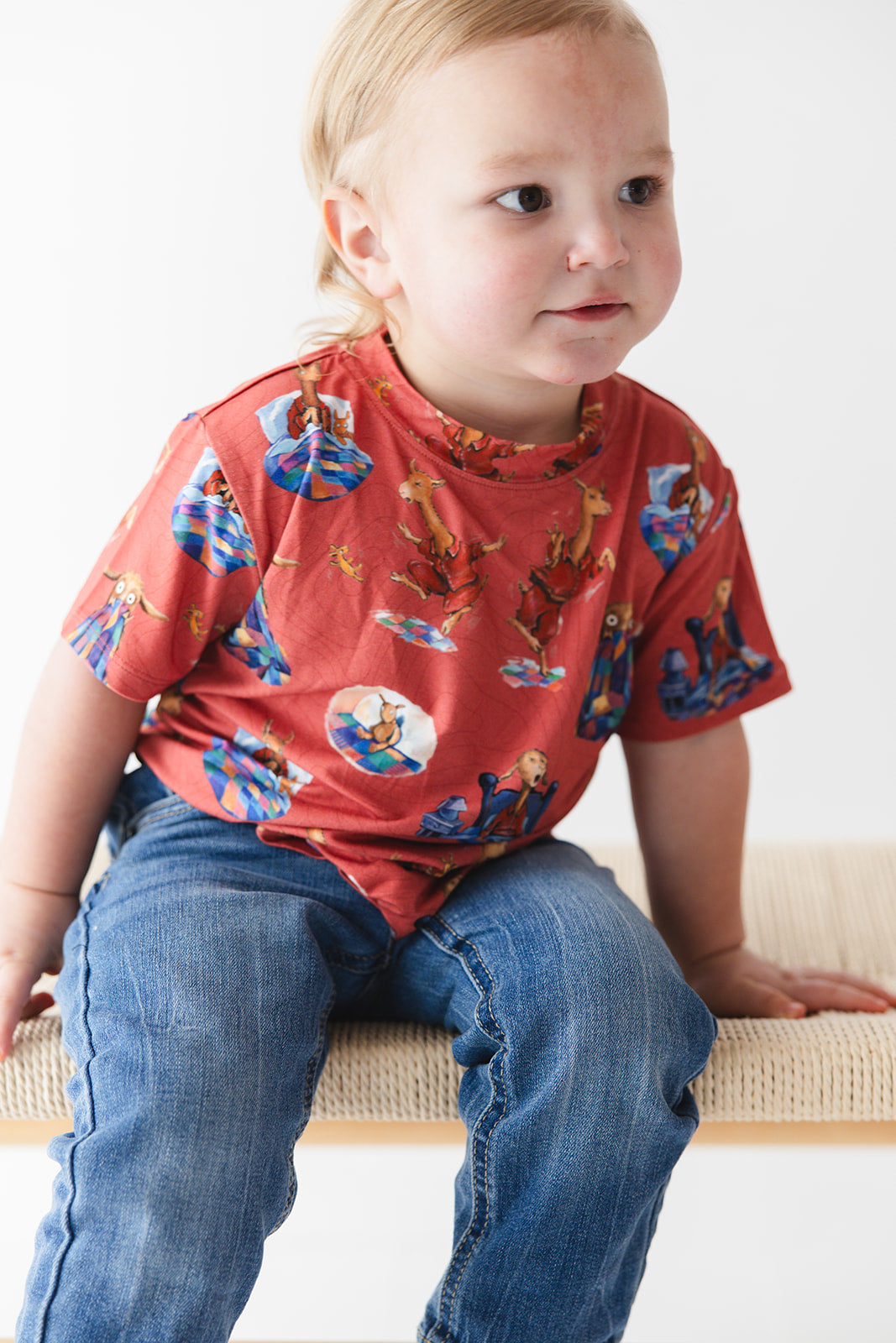 Bamboo T-Shirt for babies and toddlers, both boys and girls. Print features a red background with Llama Llama Red Pajama.