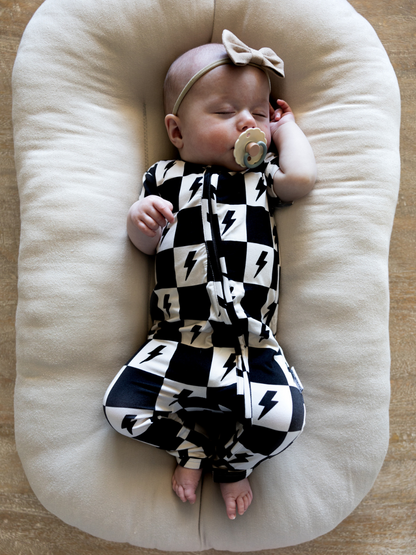 Bamboo double zipper romper with short sleeves and a checkered and lightning bolt print for boys and girls.