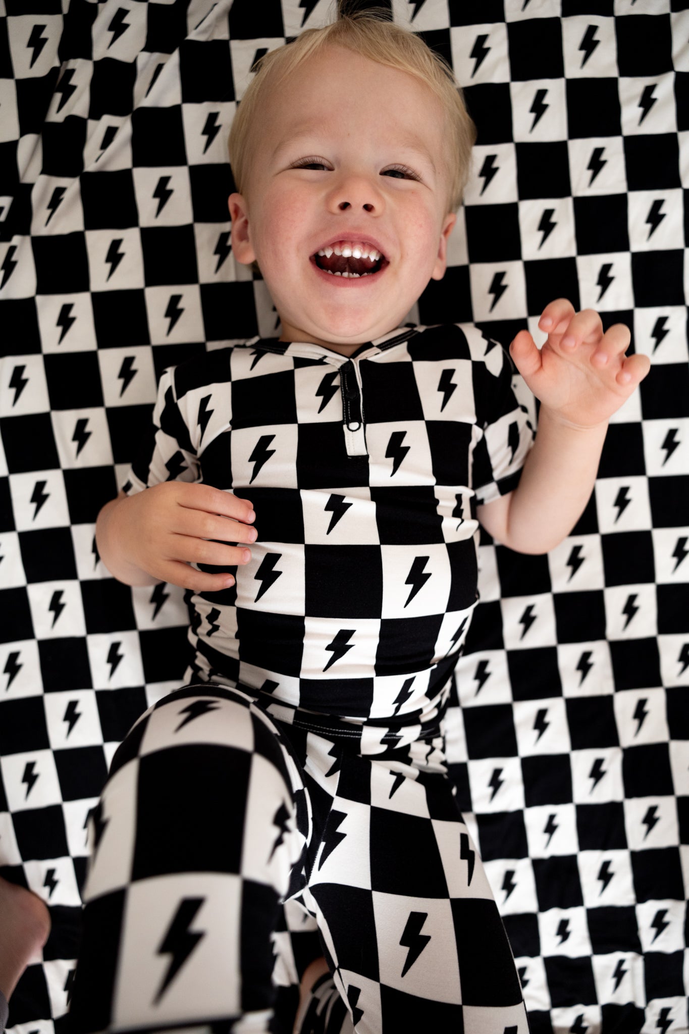 Bamboo boy and girl pajama set with checkers and lightning bolts.