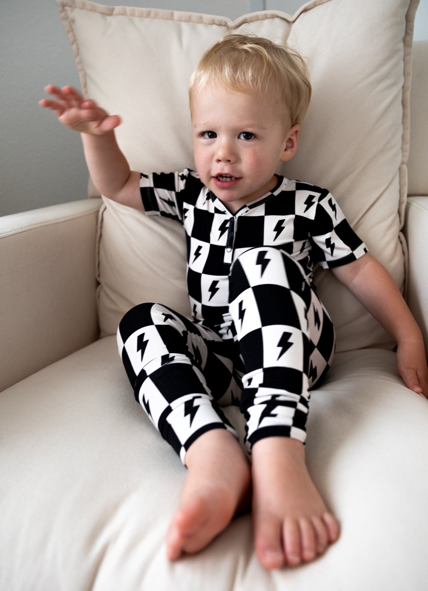 Bamboo boy and girl pajama set with checkers and lightning bolts.