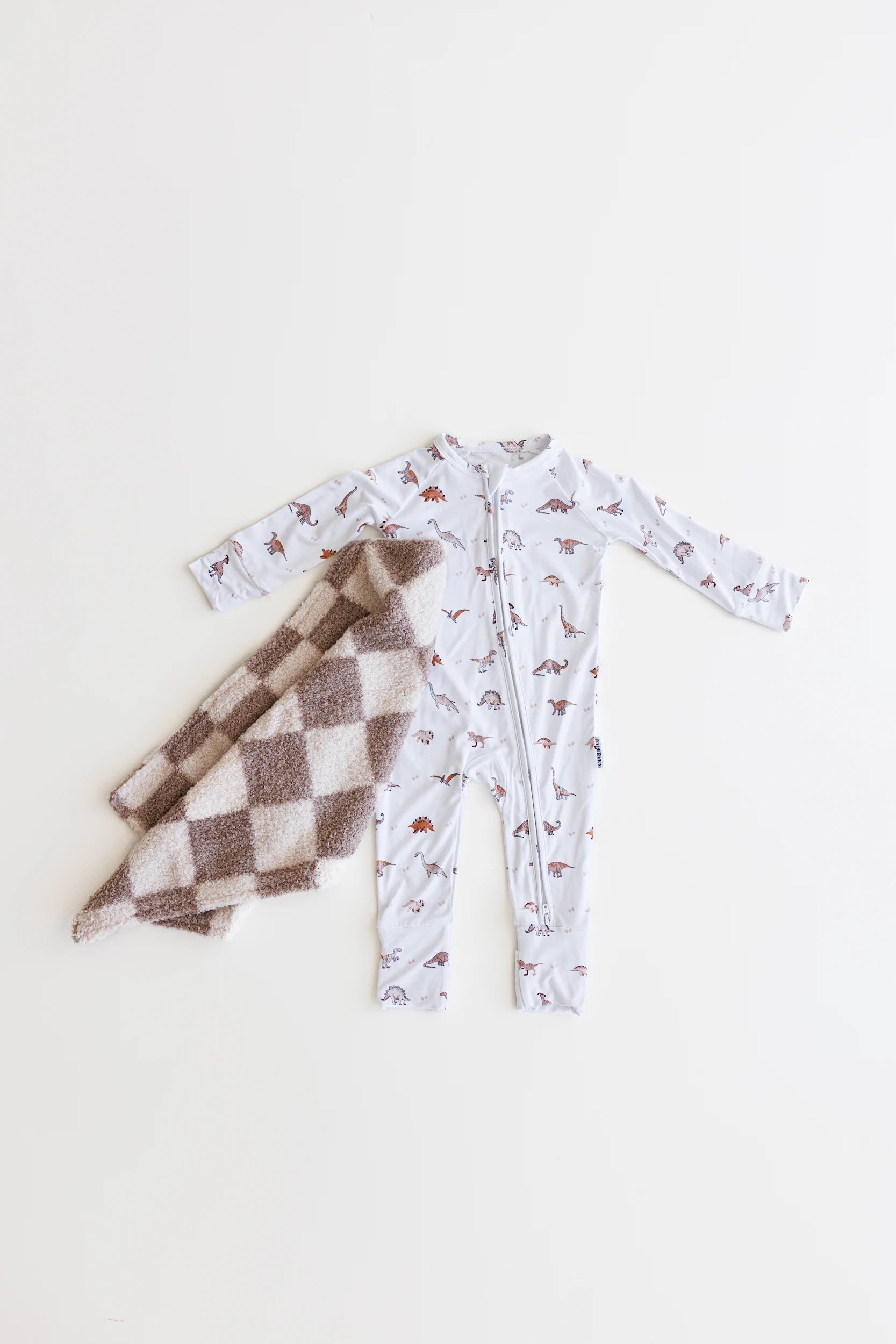 Double zipper baby romper with convertible hand & foot cuffs made from bamboo with neutral dinosaur print for boys or girls.