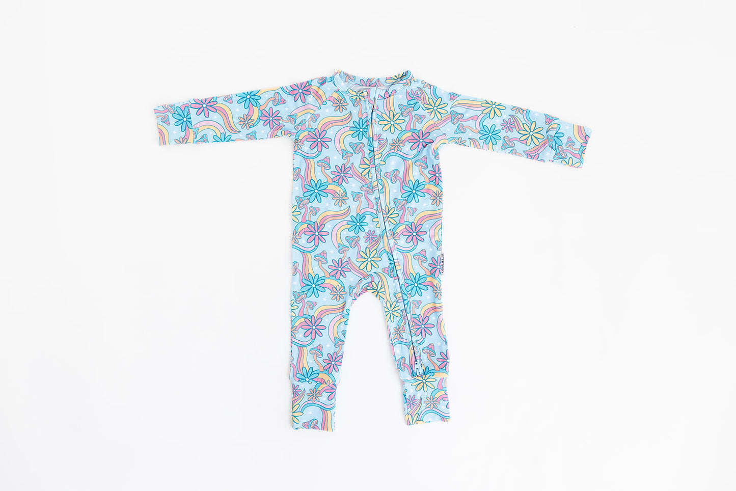 Convertible romper with hand and foot cuffs with bow made from super soft bamboo fabric. The print is a floral with mushrooms on it that looks very hippie, groovy, 70’s. Baby girl zippy with double zippers and fabric that is hypoallergenic, temperature regulating and has UV protection. 