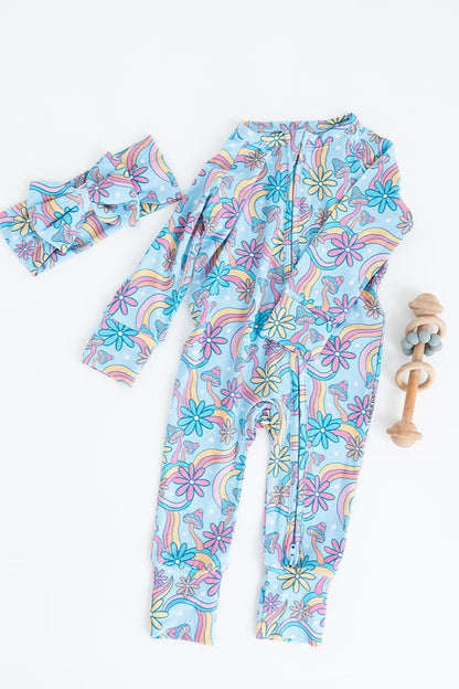 Convertible romper with hand and foot cuffs with bow made from super soft bamboo fabric. The print is a floral with mushrooms on it that looks very hippie, groovy, 70’s. Baby girl zippy with double zippers and fabric that is hypoallergenic, temperature regulating and has UV protection. 