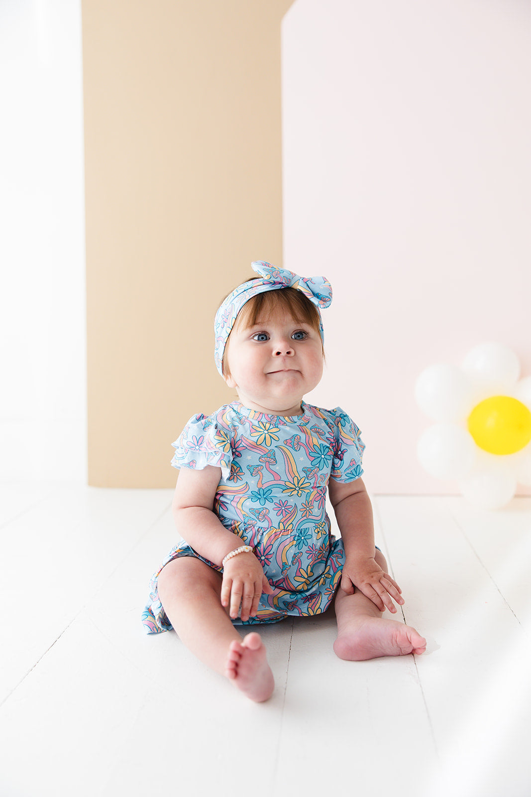 Bamboo twirl dress for baby girls and toddlers with mushrooms and florals.