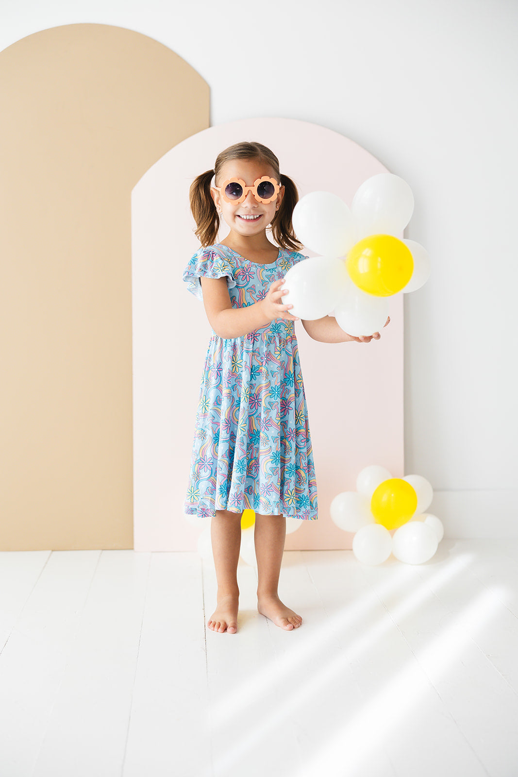 Bamboo twirl dress for baby girls and toddlers with mushrooms and florals.