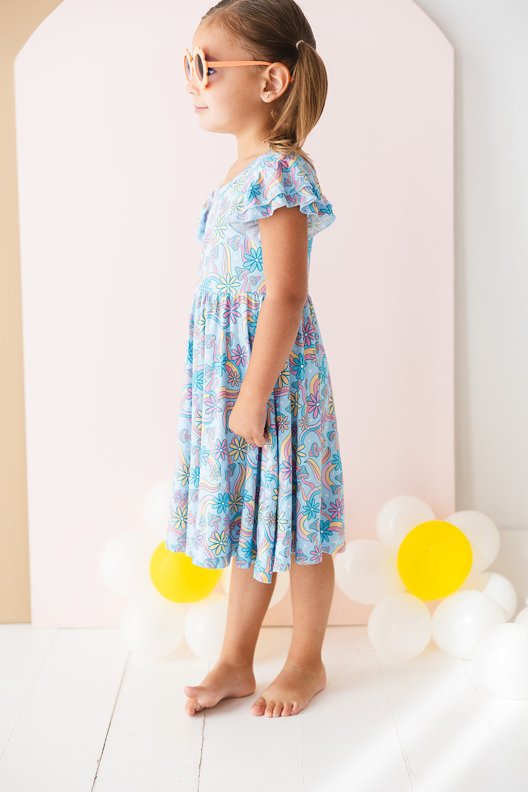 Bamboo twirl dress for baby girls and toddlers with mushrooms and florals.