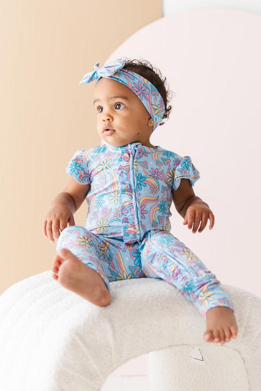 Bamboo flutter short sleeve romper in groovy, hippie, 70’s style print with florals and mushrooms for baby girl.