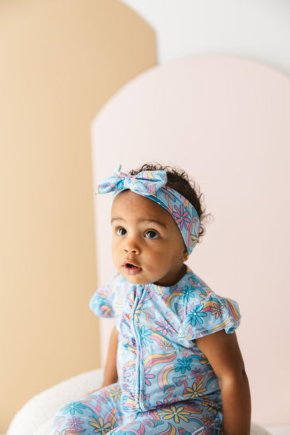 Bamboo flutter short sleeve romper in groovy, hippie, 70’s style print with florals and mushrooms for baby girl.