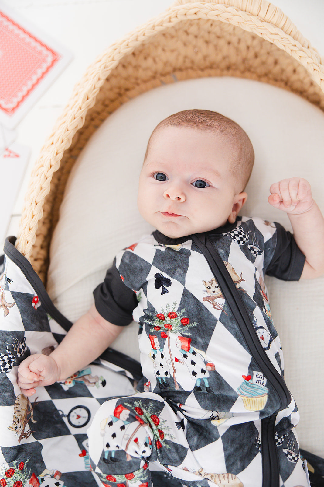 Short sleeve, double zipper romper for baby boys and girls. Gender neutral bamboo romper in Alice in Wonderland print.