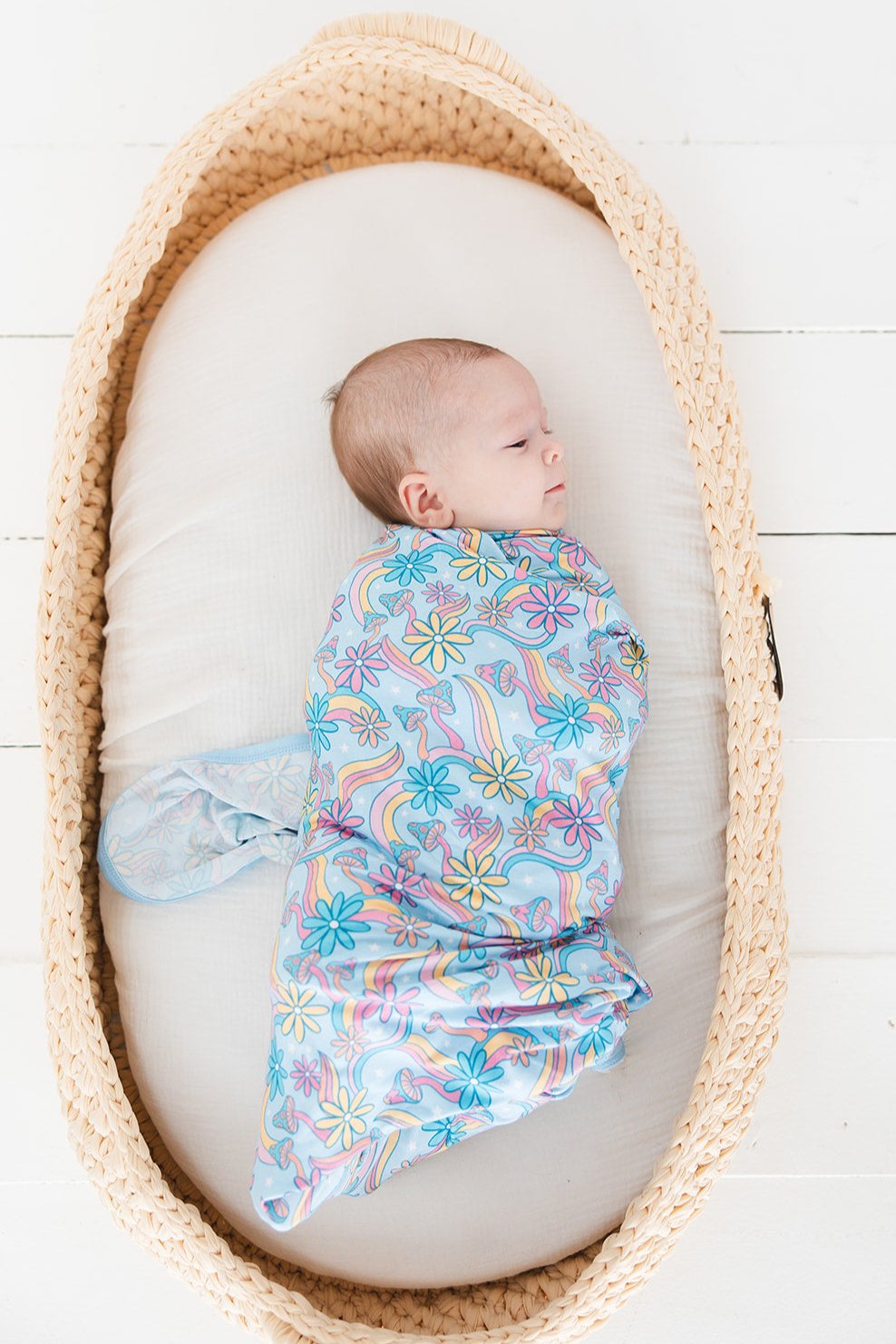 Bamboo swaddle with florals and mushrooms for baby girl. Hippie, groovy, 70’s style stretchy and soft swaddle.