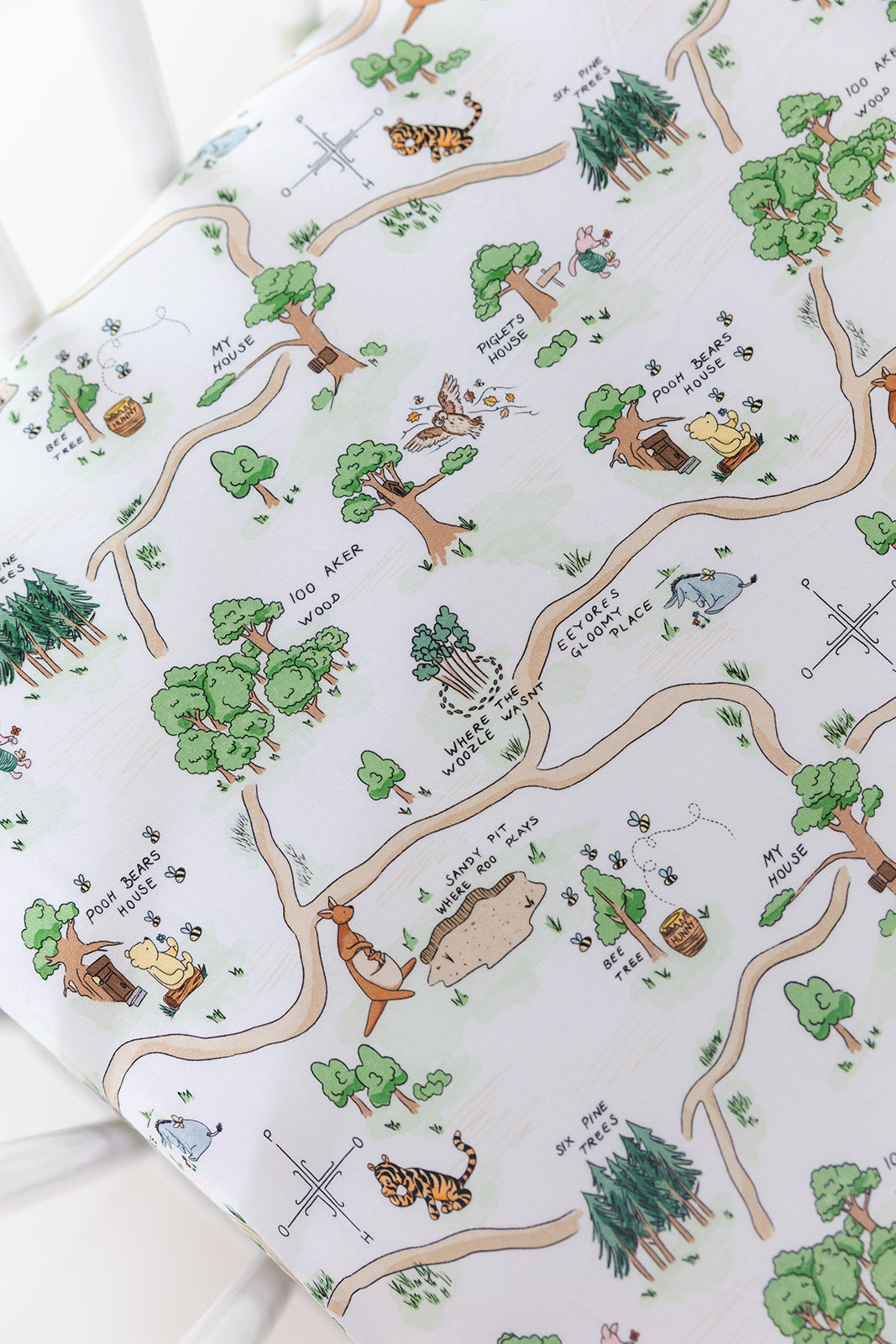 Winnie the Pooh Hundred Acre Wood bamboo crib sheet.