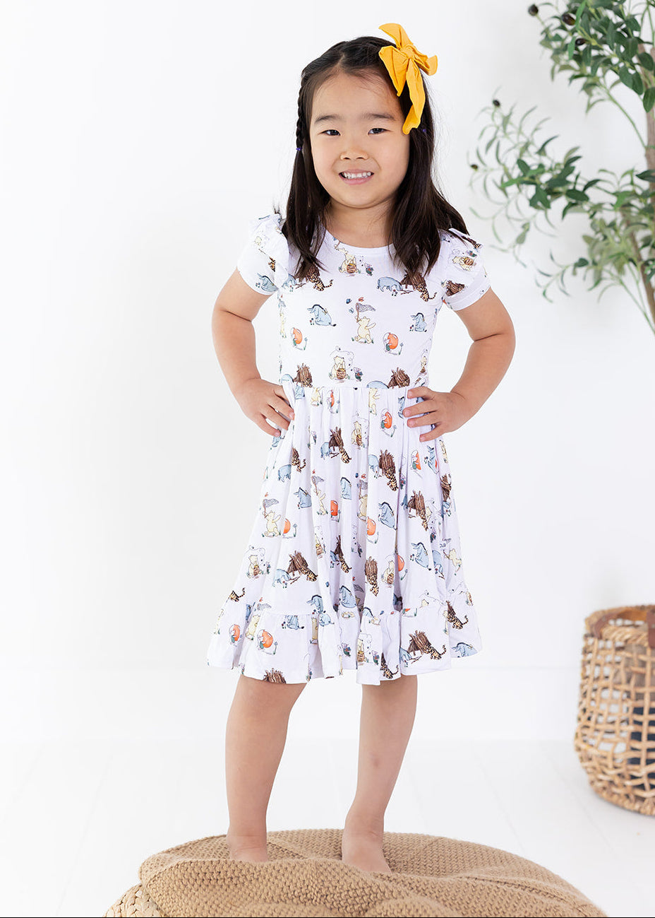Little girl Winnie the Pooh bamboo twirl dress with matching shorts for Fall.