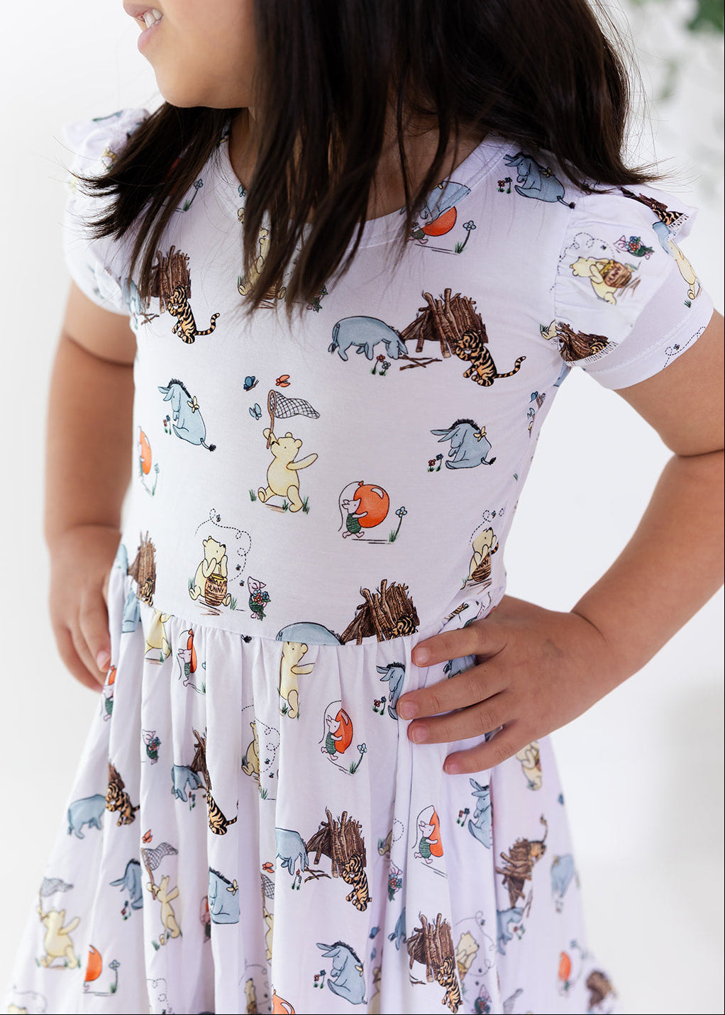 Little girl Winnie the Pooh bamboo twirl dress with matching shorts for Fall.