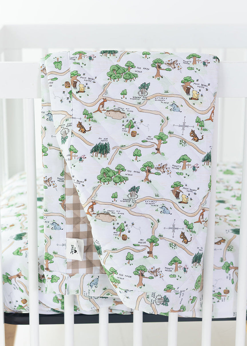 Winnie the Pooh Hundred Acre Wood double sided bamboo quilted blanket with gingham back.