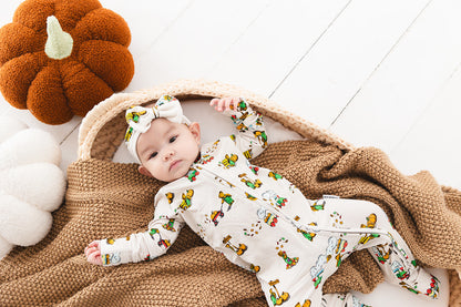 Bamboo convertible romper with hand and foot cuffs in Corduroy book print for baby boys and girls.