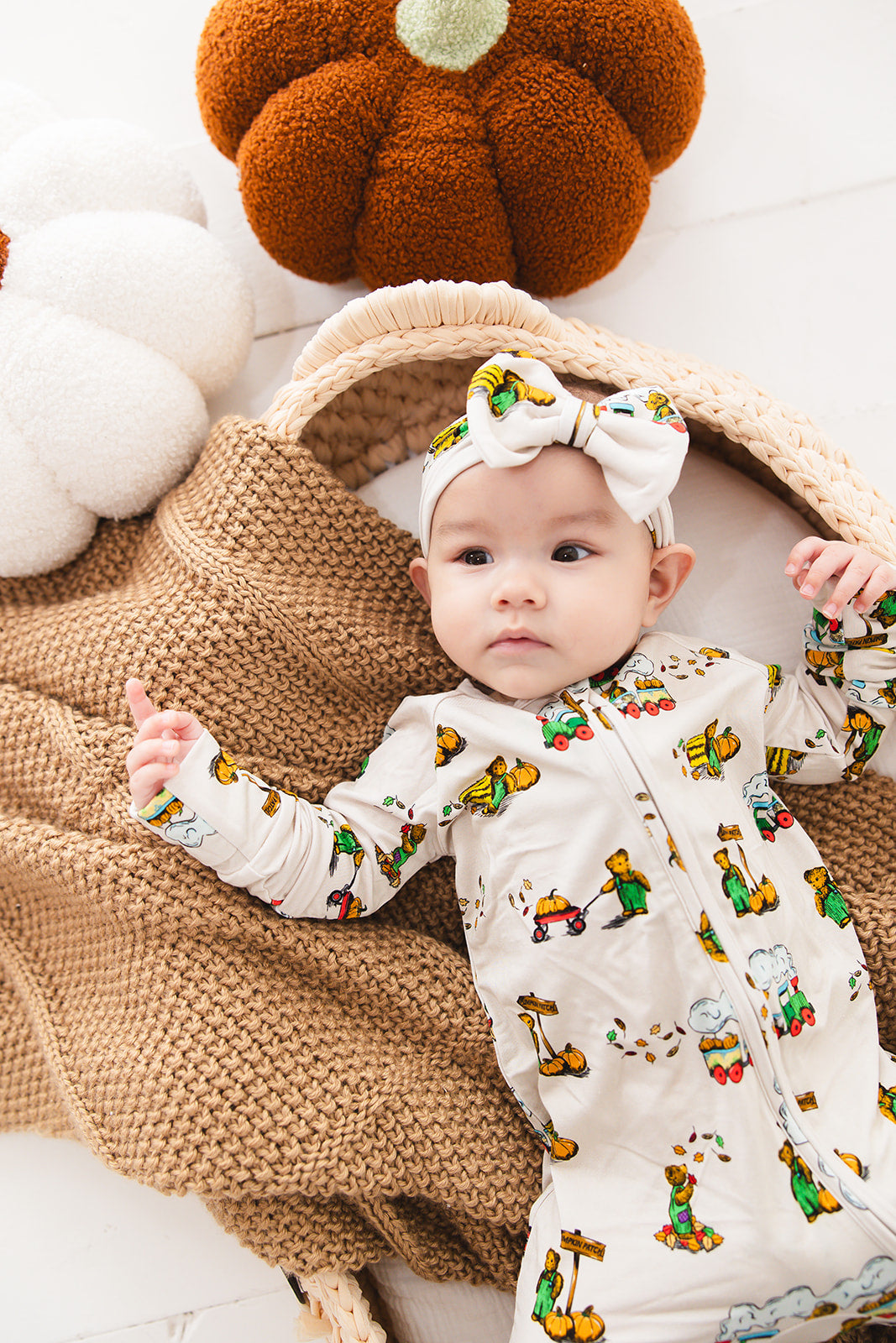 Bamboo convertible romper with hand and foot cuffs in Corduroy book print for baby boys and girls.