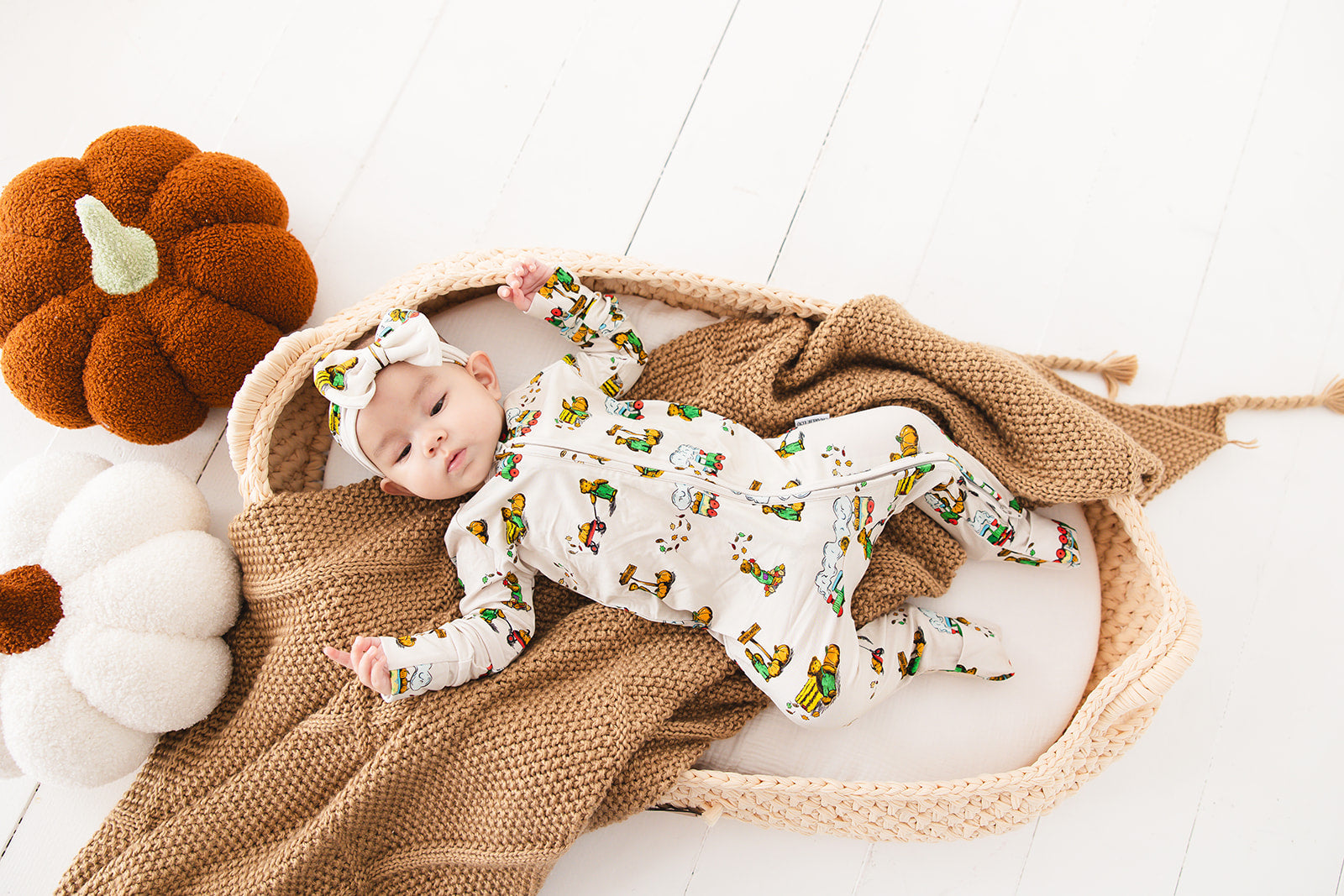 Bamboo convertible romper with hand and foot cuffs in Corduroy book print for baby boys and girls.