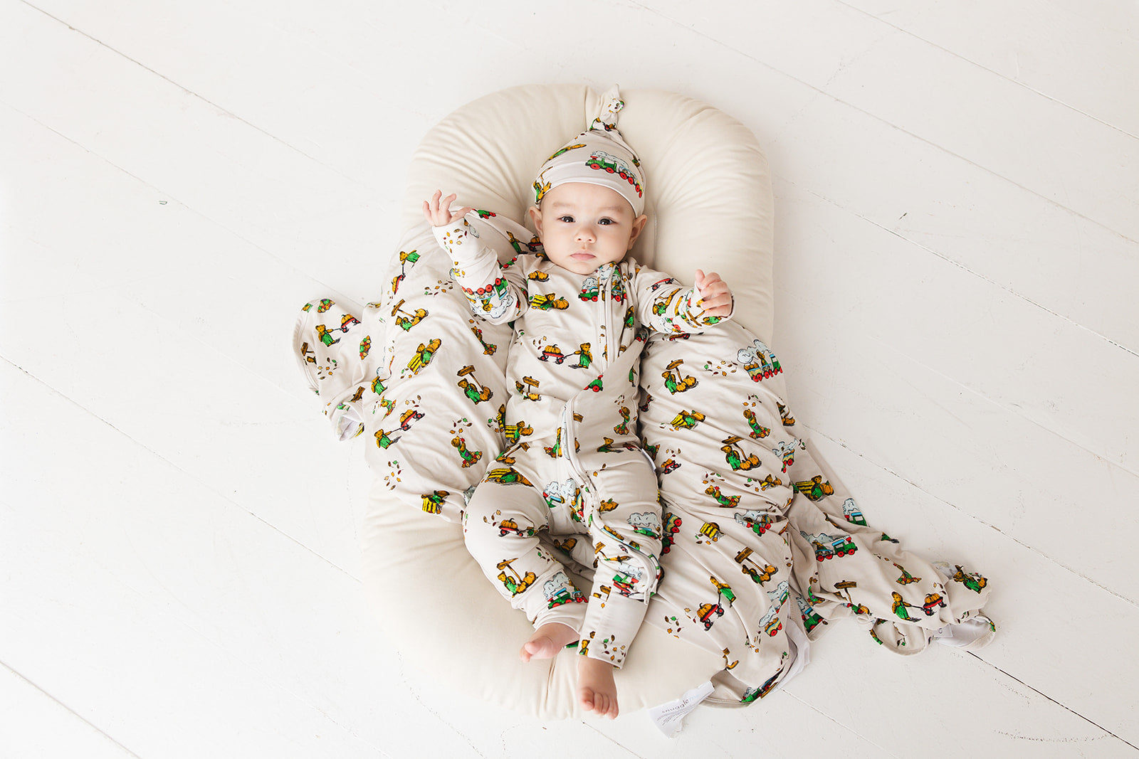 Bamboo swaddle for baby boy and girl in Corduroy book print. Gender neutral soft and stretchy bamboo swaddle.