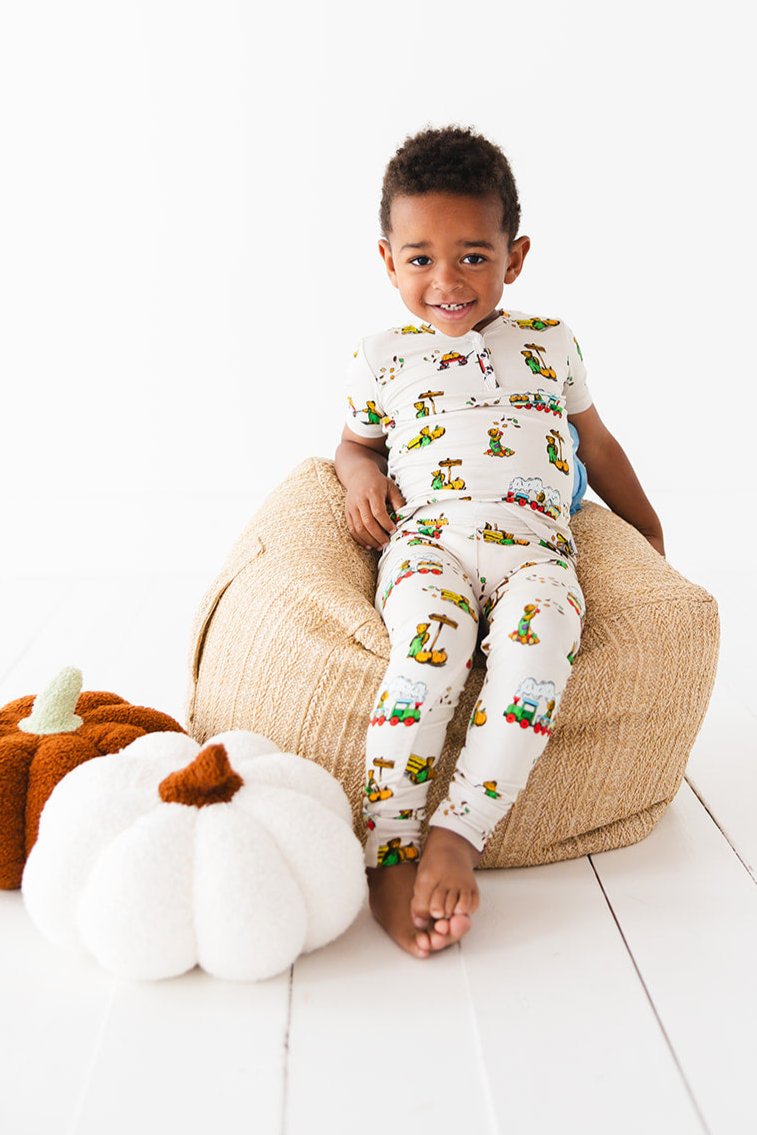 Bamboo pajama set for toddler boys and girls in fall Corduroy book print with pumpkin patch. Short sleeve, long pants toddler pajamas for winter and summer.