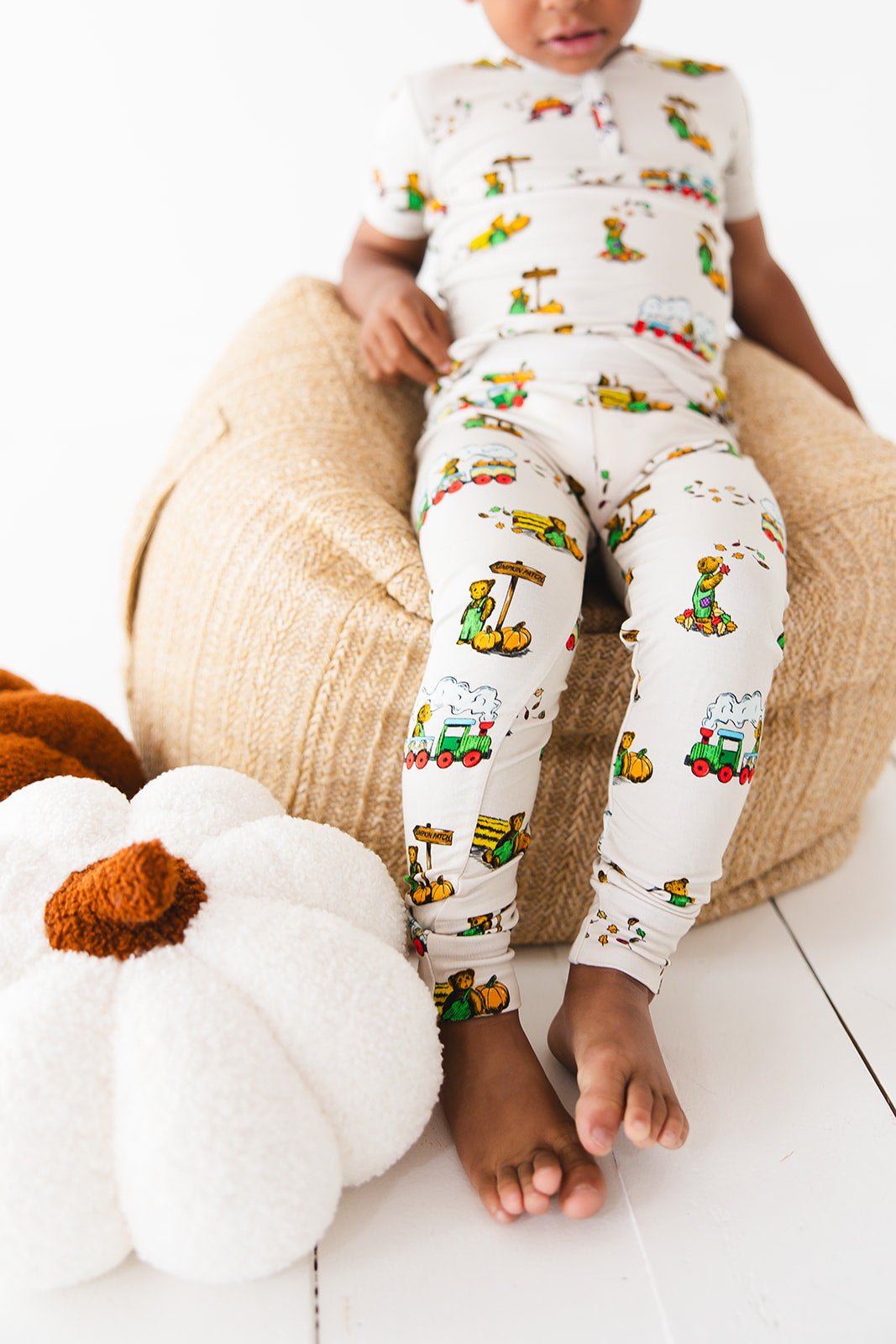 Bamboo pajama set for toddler boys and girls in fall Corduroy book print with pumpkin patch. Short sleeve, long pants toddler pajamas for winter and summer.