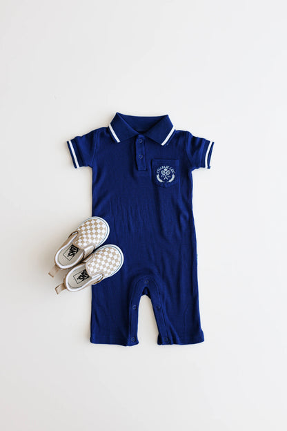 Preppy boys short sleeve polo romper with crotch snaps made from blue waffle bamboo & embroidered with Charlie Lou Baby Club.