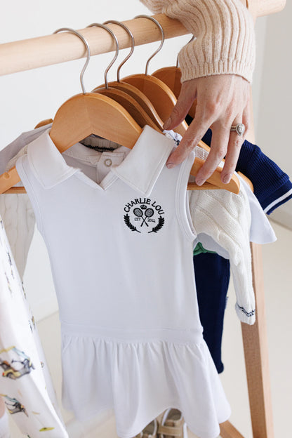 Baby girls and toddler girls white tennis dress made from bamboo with bodysuit underneath.