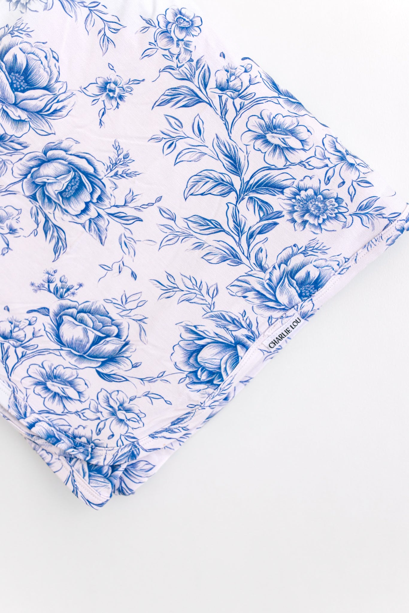 Blue floral toile bamboo swaddle for baby girl.