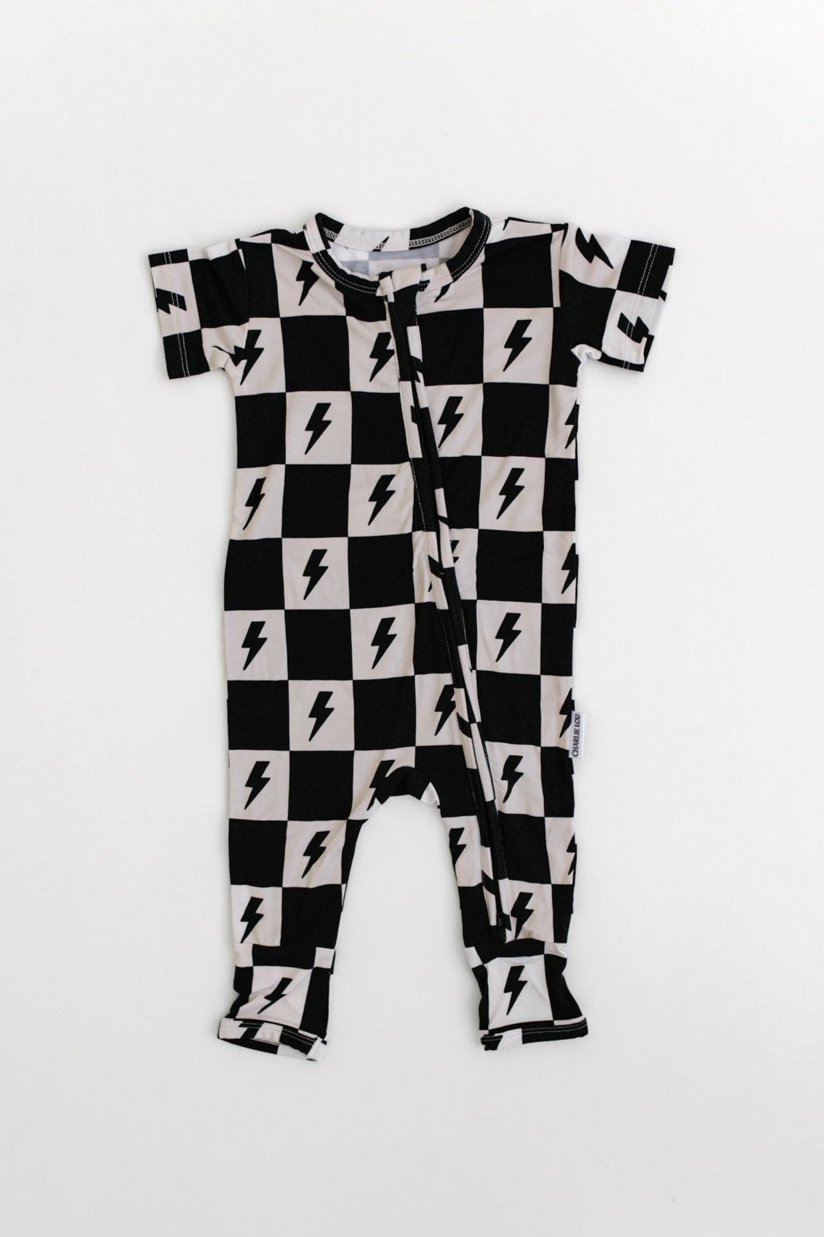 Bamboo double zipper romper with short sleeves and a checkered and lightning bolt print for boys and girls.