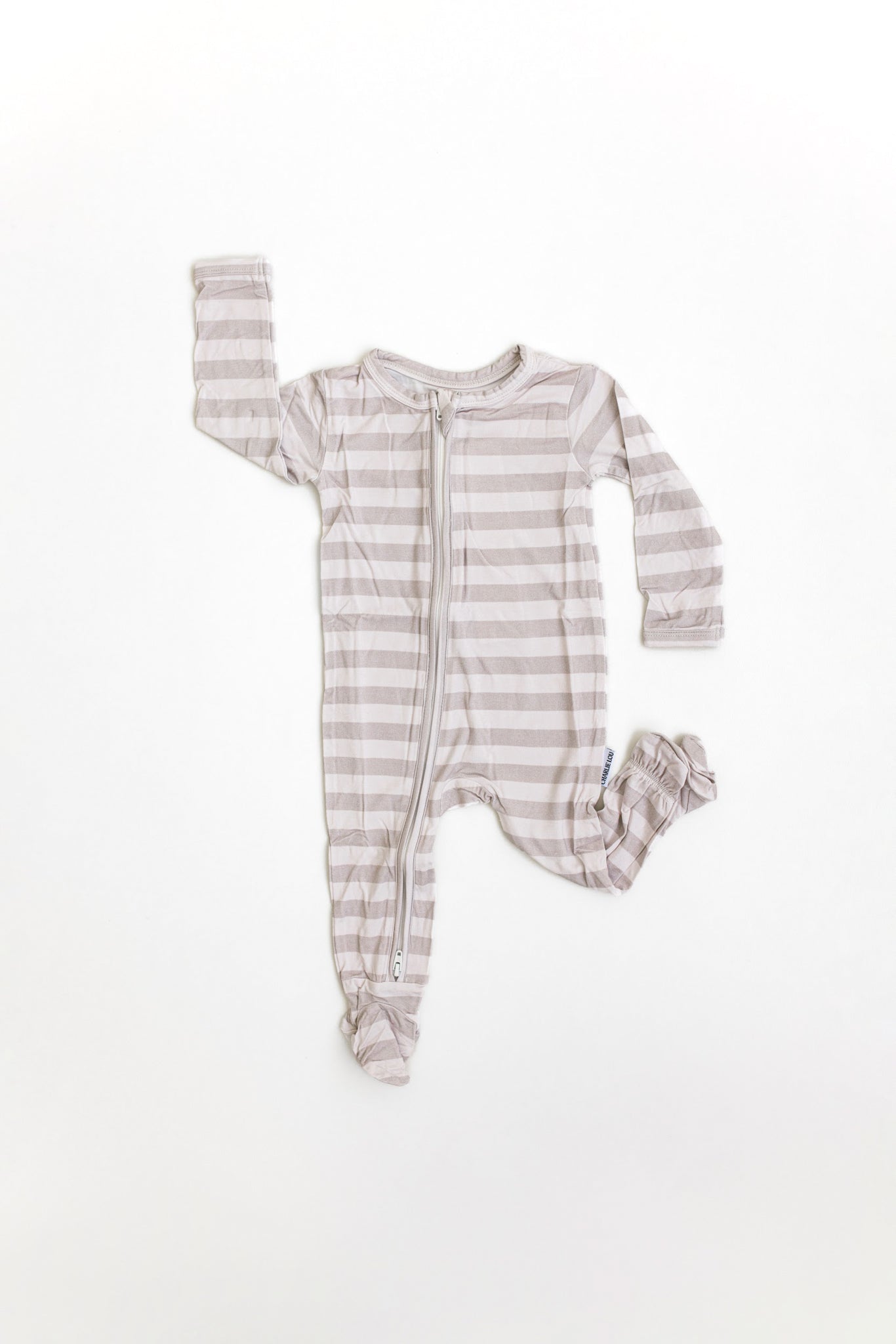 Gender neutral striped bamboo footed pajamas with double zipper.