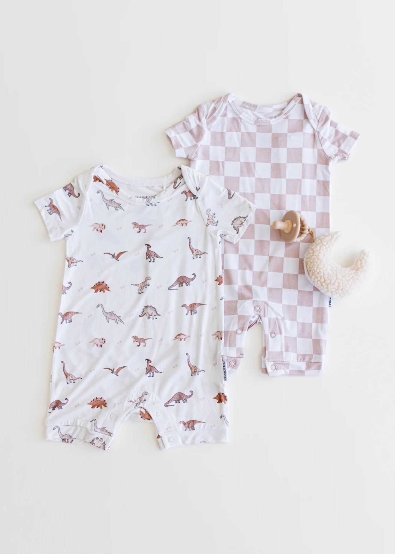 Gender neutral short sleeve romper with crotch snaps made from bamboo with neutral checkered print for boys and girls.