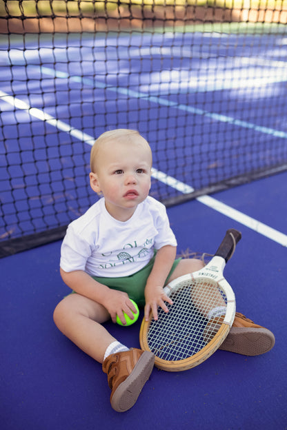 Gender neutral athletic green sports shorts for baby and toddler boys and girls.