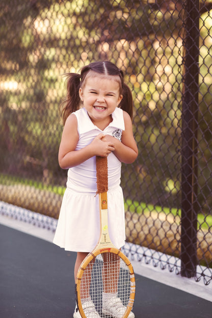 Baby girls and toddler girls white tennis dress made from bamboo with bodysuit underneath.