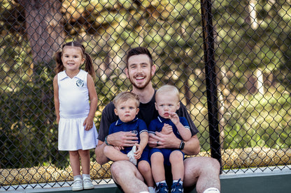 Baby girls and toddler girls white tennis dress made from bamboo with bodysuit underneath.