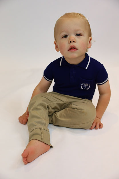 Preppy boys short sleeve polo romper with crotch snaps made from blue waffle bamboo & embroidered with Charlie Lou Baby Club.